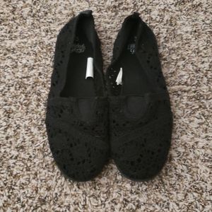 Girl's black slip ons